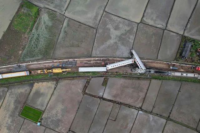 This aerial photo shows a view of two trains after they collided in Cicalengka, West Java province on January 5, 2024. Three people were killed and at least 28 injured when two trains collided on Indonesia's main island of Java on January 5, officials said. (Photo by Timur Matahari/AFP Photo)