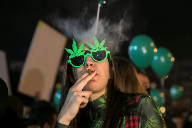 A woman smokes during an event marking Israel's government's approval of a new policy to decriminalize personal marijuana use in Tel Aviv, Israel February 4, 2017. (Photo by Baz Ratner/Reuters)