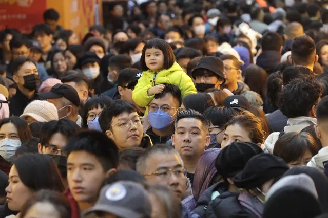 Shoppers crowd for the upcoming Lunar New Year celebrations at the Dihua street market in Taipei, Taiwan, Thursday, February 8, 2024. (Photo by Chiang Ying-ying/AP Photo)