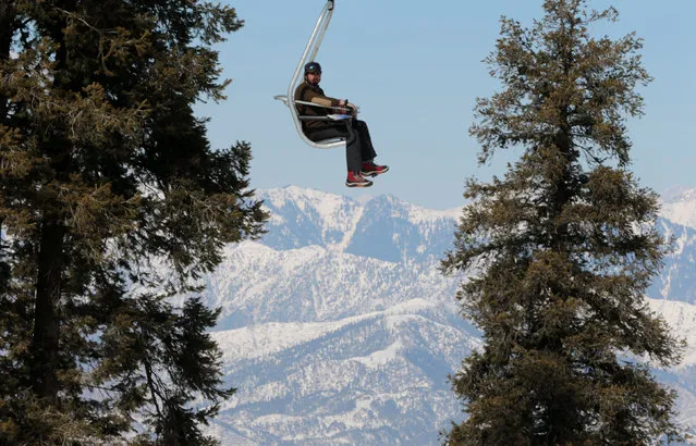 A man rides the chair lift at the ski resort in Malam Jabba, Pakistan February 7, 2017. (Photo by Caren Firouz/Reuters)