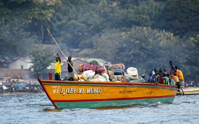 Burundian refugees sail on a boat near the shores of Lake Tanganyika in Kagunga village in Kigoma region in western Tanzania to Kigoma township, May 17, 2015. (Photo by Thomas Mukoya/Reuters)
