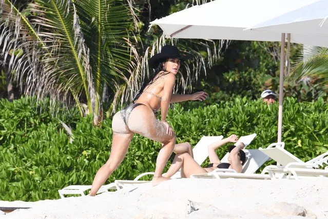 Kim and Khloe Kardashian turned up the heat on the sandy shores of Turks and Caicos on April 6, 2024. The glamorous sisters were spotted soaking up the sun in their stunning snake skin bikinis while enjoying quality beach time. Though their kids weren't pictured, the Kardashian clan was making the most of their paradise getaway while Kim wore her cowboy hat in the water. Pictured: American media personality Kim Kardashian. (Photo by Backgrid USA)