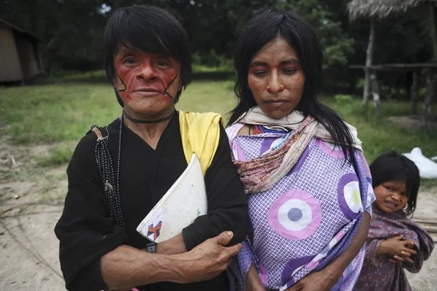 Ashaninka Indians pose for a photograph in the village of Kokasul along the Envira river in Brazil's northwestern Acre state, March 16, 2014. (Photo by Lunae Parracho/Reuters)