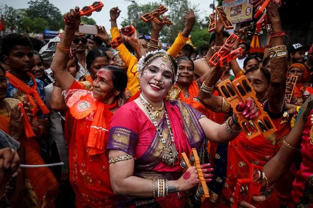 Hindu devotees dance as they take part in the annual Rath Yatra, or chariot procession, in Ahmedabad, India, July 4, 2019. (Photo by Amit Dave/Reuters)