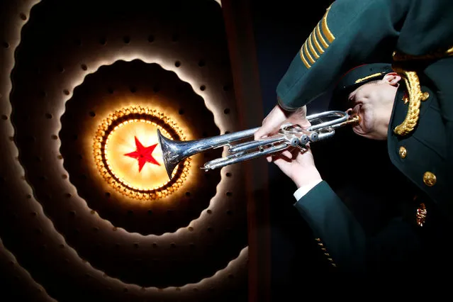 A military band member prepares ahead of the closing session of China's National People's Congress (NPC) at the Great Hall of the People in Beijing, China, March 15, 2017. (Photo by Thomas Peter/Reuters)