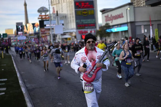 People run along the Las Vegas Strip during the Rock 'n' Roll Las Vegas Marathon half marathon, Sunday, February 27, 2022, in Las Vegas. (Photo by John Locher/AP Photo)