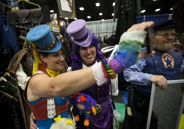 Cosplay enthusiasts Stacey Allen (L) and Laura Guiney, dressed as steampunk versions of “Rainbow Brite”, take a selfie during the 2015 Comic-Con International Convention in San Diego, California July 10, 2015. (Photo by Mario Anzuoni/Reuters)