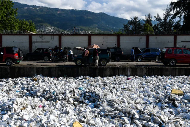 Plastic waste is seen floating on a sewage canal in the Haitian capital Port-au-Prince, on April 23, 2019. (Photo by Chandan Khanna/AFP Photo)