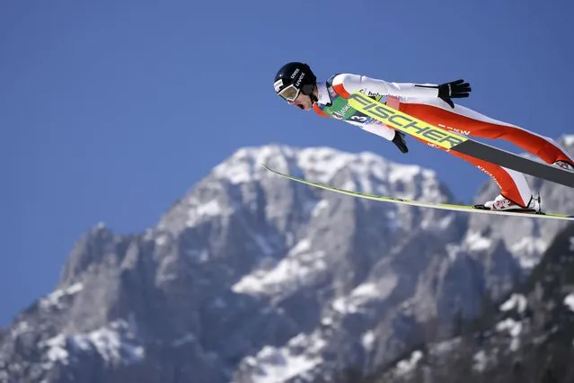 Gregor Deschwanden, of Switzerland, soars through the air during his first round jump in the Men Flying Hill Individual competition at the FIS Ski Jumping World Cup in Planica, Slovenia, Sunday, March 27, 2022. (Photo by Darko Bandic/AP Photo)