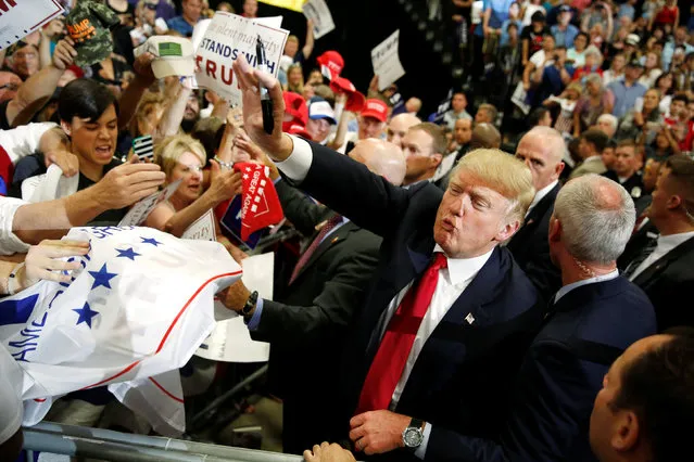 Republican U.S. presidential candidate Donald Trump blows a kiss as he signs autographs after a rally with supporters in Albuquerque, New Mexico, U.S. May 24, 2016. (Photo by Jonathan Ernst/Reuters)
