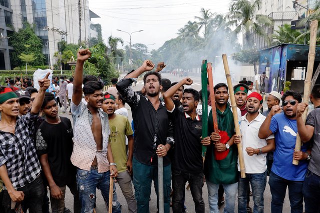 Demonstrators shout slogans after they have occupied a street during a protest demanding the stepping down of Bangladeshi Prime Minister Sheikh Hasina, following quota reform protests by students, in Dhaka, Bangladesh, on August 4, 2024. (Photo by Mohammad Ponir Hossain/Reuters)