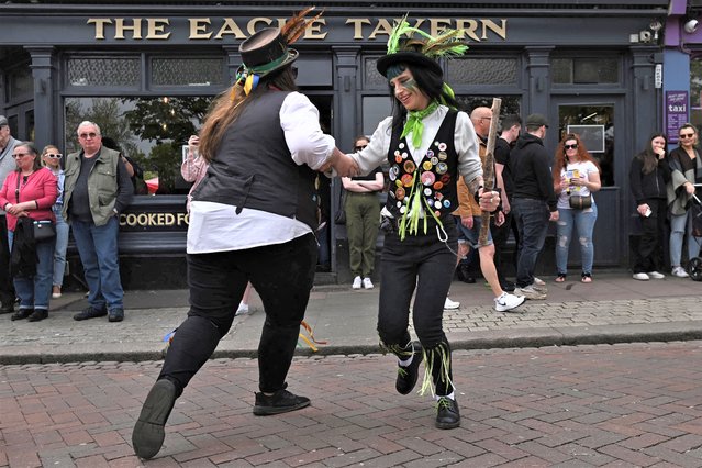 Members of the Dead Horse Morris dancing team take part in the 2023 Sweeps Festival in Rochester, south-east of London, on April 30, 2023. The Rochester Sweeps Festival is a celebration of folk music and dance, it has become one of the largest May Day celebrations. (Photo by Ben Stansall/AFP Photo)