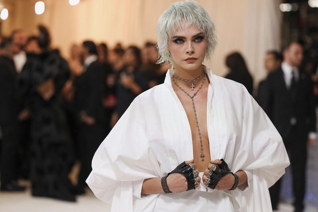 English model and actress Cara Delevingne poses at the Met Gala, an annual fundraising gala held for the benefit of the Metropolitan Museum of Art's Costume Institute with this year's theme “Karl Lagerfeld: A Line of Beauty”, in New York City, New York, U.S., May 1, 2023. (Photo by Andrew Kelly/Reuters)