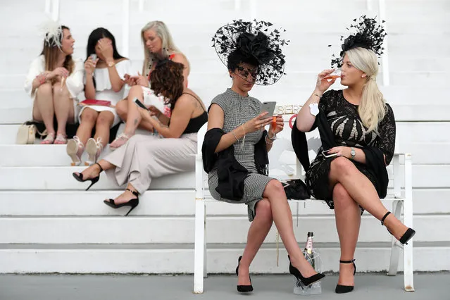 Race goers are pictured during the Investec Ladies Day at Epsom Downs Racecourse on June 2, 2017 in Epsom, England. (Photo by Andrew Matthews/PA Wire)