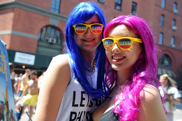 Spectators share a “Hello Sunny” moment during the New York Gay Pride Parade, Sunday, June 29, 2014.  (Photo by Diane Bondareff/Invision for Greater Fort Lauderdale Convention & Visitors Bureau/AP Images)