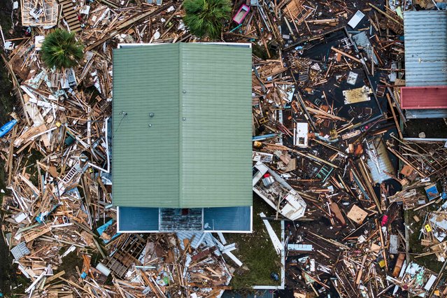 An aerial view of damaged houses are seen after Hurricane Helene made landfall in Horseshoe Beach, Florida, on September 28, 2024. At least 44 people died across five US states battered by powerful storm Helene, authorities said on September 27, after torrential flooding prompted emergency responders to launch massive rescue operations. (Photo by Chandan Khanna/AFP Photo)