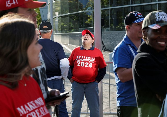 A supporter of Republican presidential nominee and former U.S. President Donald Trump reacts on the day of a campaign event at the Cobb Energy Performing Arts Centre in Atlanta, Georgia on October 15, 2024. (Photo by Dustin Chambers/Reuters)