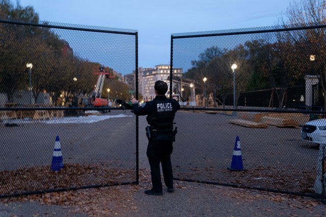 A member of the U.S. Secret Service closes a security gate along Pennsylvania Avenue near the White House on the day before the U.S. presidential election in Washington on November 4, 2024. (Photo by Nathan Howard/Reuters)