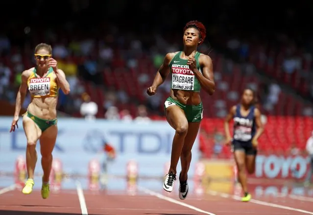 Blessing Okagbare of Nigera (C) competes in the women's 100 metres heats during the 15th IAAF World Championships at the National Stadium in Beijing, China August 23, 2015. (Photo by Lucy Nicholson/Reuters)