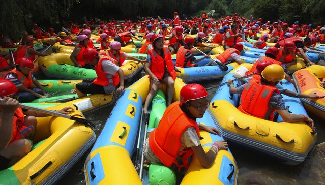 Rafting jam caused by a large number of rafts is seen on August 2, 2014 in Sanmenxia, Henan province of China.  (Photo by ChinaFotoPress/ChinaFotoPress via Getty Images)