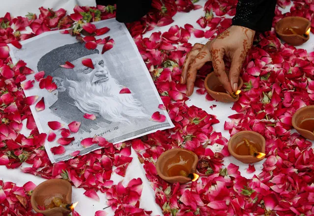 People light oil lamps to mourn the death of Pakistani philanthropist Abdul Sattar Edhi, in Karachi, Pakistan July 12, 2016. (Photo by Akhtar Soomro/Reuters)