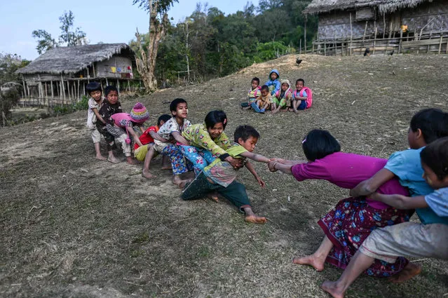 This photo taken on February 4, 2020 shows children playing in front of the school in Toe Lawt in Lahe township in Myanmar's Sagaing region. (Photo by Ye Aung Thu/AFP Photo)