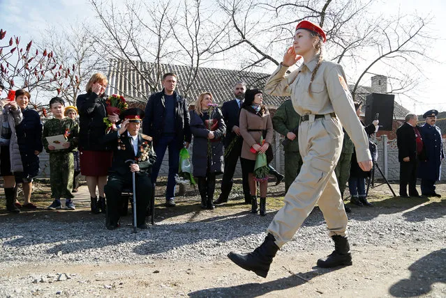 Vladimir Khlapov, a 97-year-old World War Two veteran, salutes during a military parade organized personally for him on his birthday, as part of preparing the celebration of the 75th anniversary of the victory over Nazi Germany in World War Two, in the rebel-controlled town of Dokuchaevsk in Donetsk region, Ukraine on March 4, 2020. (Photo by Alexander Ermochenko/Reuters)