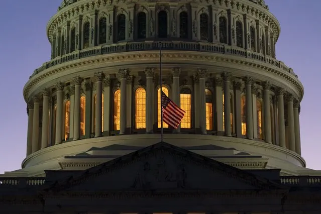The American flag flies at half-staff over the U.S. Capitol, Thursday, September 8, 2022, on Capitol Hill in Washington, after Queen Elizabeth II, Britain's longest-reigning monarch and a rock of stability across much of a turbulent century, died Thursday after 70 years on the throne. She was 96. (Photo by Jacquelyn Martin/AP Photo)
