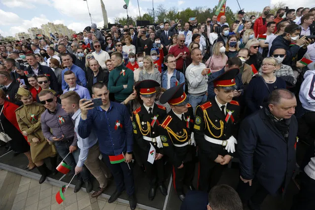 People attend the Victory Day military parade that marked the 75th anniversary of the allied victory over Nazi Germany, in Minsk, Belarus, Saturday, May 9, 2020. Belarus remains one of the few countries that hadn't imposed a lockdown or restricted public events despite recommendations of the World Health Organization. (Photo by Sergei Grits/AP Photo)