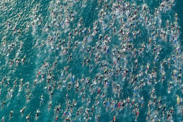 An aerial view of the start of the swim portion of the IRONMAN World Championships on October 08, 2022 in Kailua Kona, Hawaii. (Photo by Ezra Shaw/Getty Images for IRONMAN)