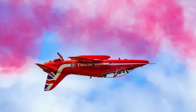 Picture dated June 12th, 2022 shows the Red Arrows performing at at the RAF Cosford Air Show in the West Midlands which was held for the first time in three years due to covid cancelations. (Photo by Claire Hartley/Bav Media)