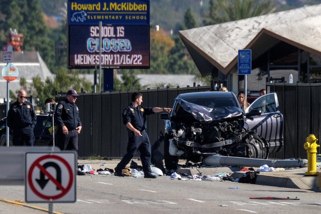 Law enforcement investigate the scene after multiple Los Angeles County Sheriff's Department recruits were injured when a car crashed into them while they were out for a run in Whittier, California, U.S. November 16, 2022. (Photo by Ringo Chiu/Reuters)