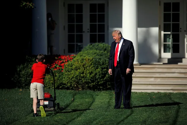U.S. President Donald Trump welcomes 11-years-old Frank Giaccio as he cuts the Rose Garden grass at the White House in Washington, September 15. Frank, who wrote a letter to Trump offering to mow the White House lawn, was invited to work for a day at the White House along the National Park Service staff on September 15, 2017. (Photo by Carlos Barria/Reuters)