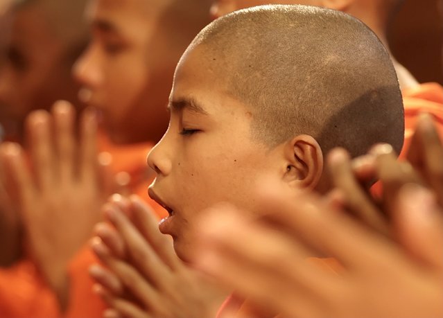 Buddhist monks pray during the Buddha Jayanti, or Buddha Purnima, also known as Vesak Day, celebrations organized by the Maha Bodhi Society in Bangalore, India, 12 May 2025. Buddhists celebrate Vesak Day to mark the date of birth, enlightenment and passing of Gautama Buddha (Gautama Siddhartha). (Photo by Jagadeesh N.V./EPA/EFE)