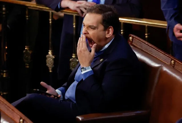 Newly elected freshman Rep. George Santos (R-NY), embroiled in a scandal over his resume and claims made on the campaign trail, yawns behind his hand as he sits alone in the House Chamber, on the first day of the 118th Congress at the U.S. Capitol in Washington, U.S., January 3, 2023. (Photo by Jonathan Ernst/Reuters)