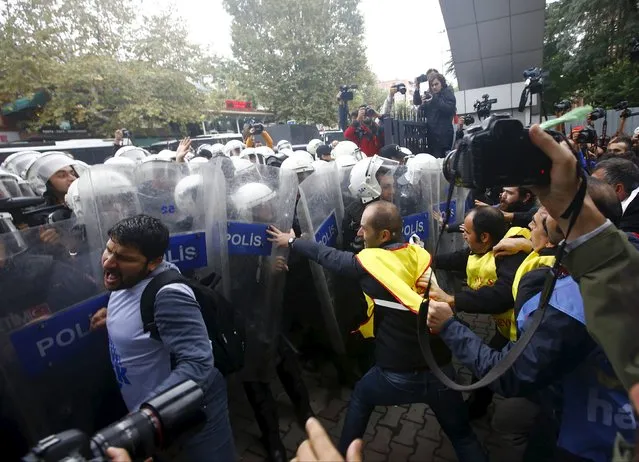 Demonstrators are stopped by the police during a protest against Saturday's bombings that took place in Ankara, in Istanbul, Turkey, October 13, 2015. Turkey's government said on Monday Islamic State was the prime suspect in suicide bombings that killed at least 97 people in Ankara, but opponents vented anger at President Tayyip Erdogan at funerals, universities and courthouses. (Photo by Osman Orsal/Reuters)