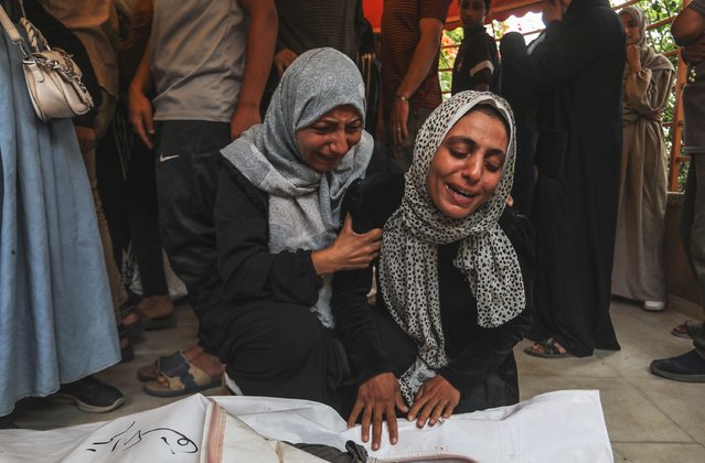 Palestinians mourn their loved ones after the bodies were brought to the morgue of Nasser Hospital following Israeli strikes on various areas in Khan Yunis, Gaza on June 9, 2025. (Photo by Abed Rahim Khatib/Anadolu via Getty Images)