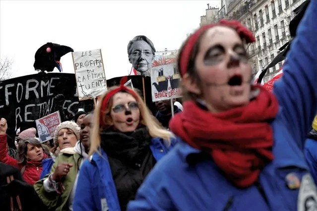 Femimist activists dressed as Rosie the Riveter icon perform during a demonstration against the French government's pension reform plan in Paris as part of a day of national strike and protests in France on January 19, 2023. (Photo by Benoit Tessier/Reuters)