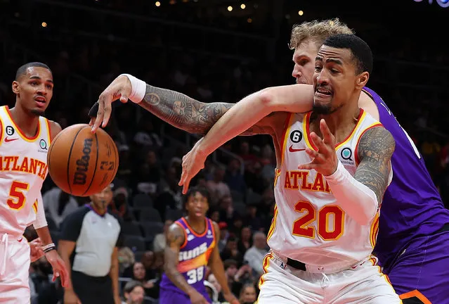 John Collins #20 of the Atlanta Hawks battles for a rebound against Jock Landale #11 of the Phoenix Suns during the fourth quarter at State Farm Arena on February 09, 2023 in Atlanta, Georgia. (Photo by Kevin C. Cox/Getty Images)