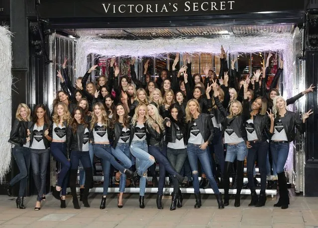 47 Victoria's Secret models pose outside Victoria Secret's New Bond Street Store in London on December 1, 2014, during a photocall to mark the countdown to the 2014 Victoria's Secret Fashion Show. (Photo by Yui Mok/PA Wire)
