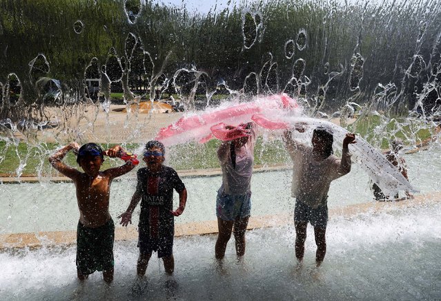 Children play at a fountain to cool off at a park as the Japanese government issued a heatstroke alert in Tokyo and other prefectures due to a heatwave in Tokyo, Japan, on August 4, 2025. (Photo by Issei Kato/Reuters)