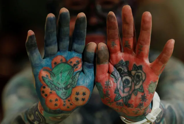 Author Hiroki Takamura, 62, shows tattoos on his palms at the annual gathering of the Irezumi Aikokai (Tattoo Lovers Association) in Tokyo, Japan, February 16, 2020. “In the 2000s, tattoo magazines began to increase and even women began to get more tattoos. I thought there was hope that tattoos would finally be accepted the way they are in Europe”, said Takamura. (Photo by Kim Kyung-Hoon/Reuters)