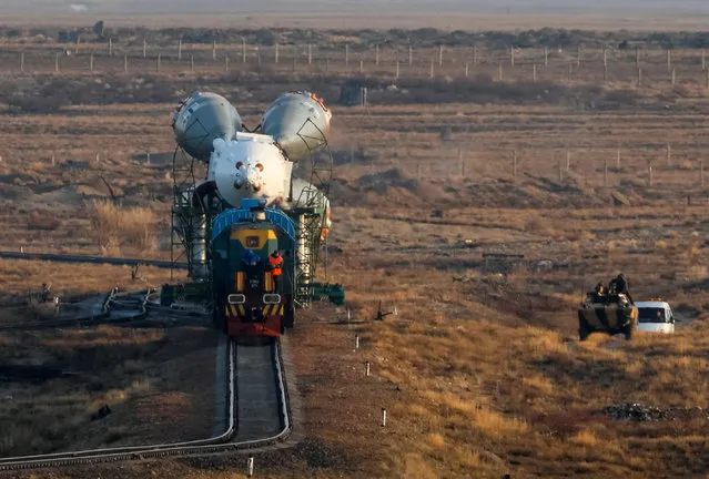 The Soyuz MS-08 spacecraft for the next International Space Station (ISS) crew, consisting of astronauts Drew Feustel and Ricky Arnold of the U.S and crewmate Oleg Artemyev of Russia, is transported from an assembling hangar to the launchpad ahead of its upcoming launch, at the Baikonur Cosmodrome, Kazakhstan on March 19, 2018. Expedition 55 crew members Ricky Arnold and Drew Feustel of NASA and Oleg Artemyev of Roscosmos are scheduled to launch on March 21 and will spend the next five months living and working aboard the International Space Station. (Photo by Shamil Zhumatov/Reuters)