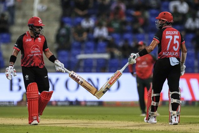 Hong Kong's Nizakat Khan, right, and Hong Kong's Zeeshan Ali touch bats as they celebrate during the Asia Cup Cricket match between Bangladesh and Hong Kong at Zayed Cricket Stadium in Abu Dhabi, United Arab Emirates, Thursday, September 11, 2025. (Photo by Fatima Shbair/AP Photo)