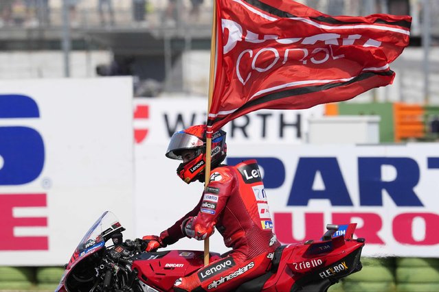 Ducati Lenovo Team rider Marc Marquez of Spain celebrates the victory of the MotoGP race of the San Marino and the Rimini Riviera Grand Pri at the Misano World Circuit Marco Simoncelli in Misano Adriatico, Italy, 14 September 2025. (Phto by Danilo Di Giovanni/EPA)