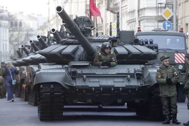 Russian T-72 tanks stand in line prior to a rehearsal for the Victory Day military parade which will take place at Dvortsovaya (Palace) Square on May 9 to celebrate 73 years after the victory in WWII, in St.Petersburg, Russia, Monday, April 30, 2018. (Photo by Dmitri Lovetsky/AP Photo)