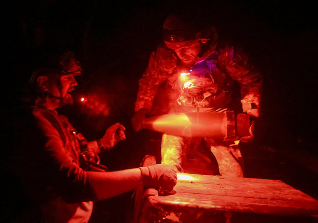Artillerymen of the 152nd Separate Jaeger Brigade unload shells for an M114 self-propelled howitzer, amid Russia's attack on Ukraine, near the frontline town of Pokrovsk in Donetsk region, Ukraine on October 14, 2025. (Photo by Anatolii Stepanov/Reuters)
