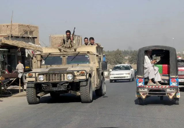Afghan security forces travel on an armored vehicle in Kunduz Province, Afghanistan September 28, 2015. (Photo by Reuters/Stringer)
