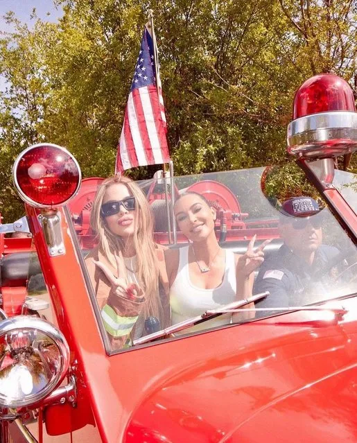 American socialites Kim (R) and Khloé Kardashian drive around in a firetruck in the first decade of May 2023. (Photo by kimkardashian/Instagram)