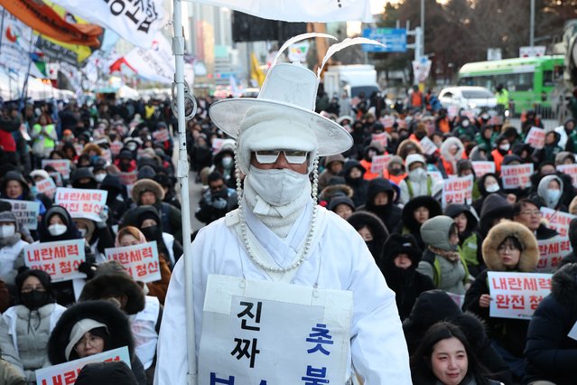 Members from the Korean Confederation of Trade Unions (KCTU) participate in a rally to mark the first anniversary of former President Yoon Suk Yeol's brief imposition of martial law, in front of the National Assembly on December 03, 2025 in Seoul, South Korea. A year has passed since then-President Yoon Suk Yeol declared a state of emergency martial law, stunning Korea and setting off a political crisis that continues to reverberate today. (Photo by Chung Sung-Jun/Getty Images)